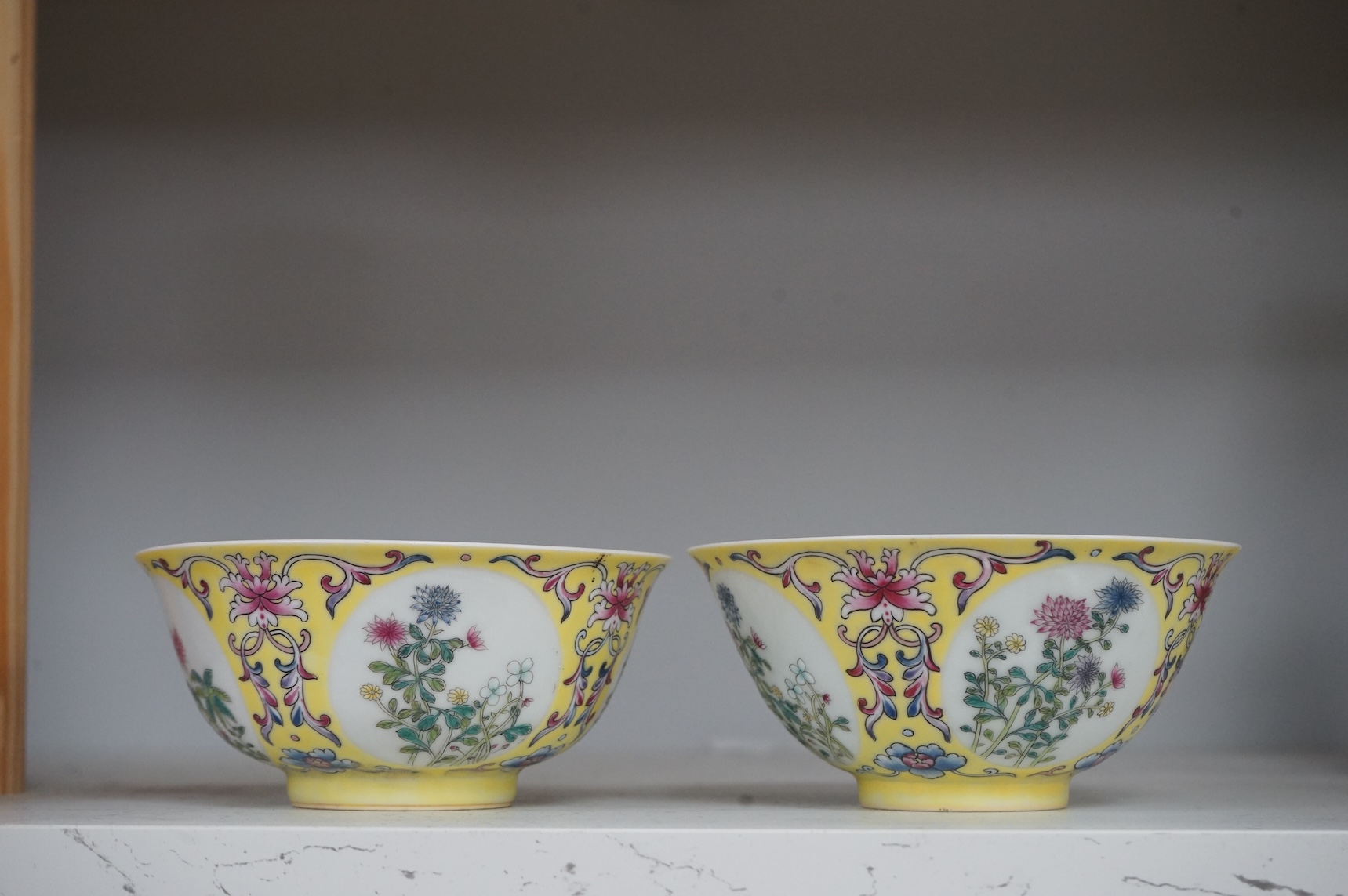 A pair of Chinese yellow ground medallion bowls, 13cm diameter